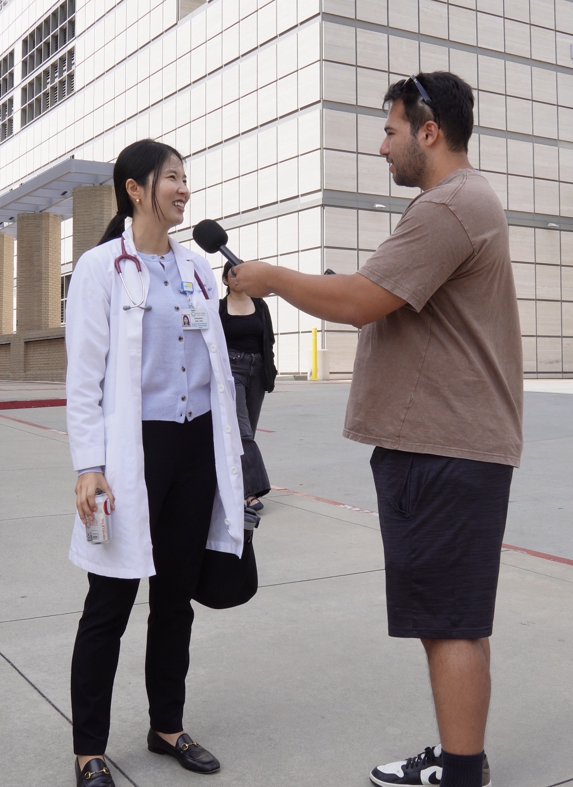 London interviewing a doctor in a white coat